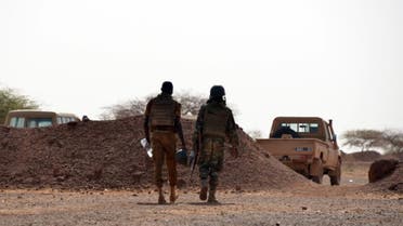 Burkina Faso soldiers patrol near Tambao mine in Tambao, 350 kilometers (220 miles) northeast of the capital, Ouagadougou on April 5, 2015, where five armed men attacked a manganese mine and kidnapped a Romanian mineworker the day before (AFP Photo/Ahmed Ouoba) 