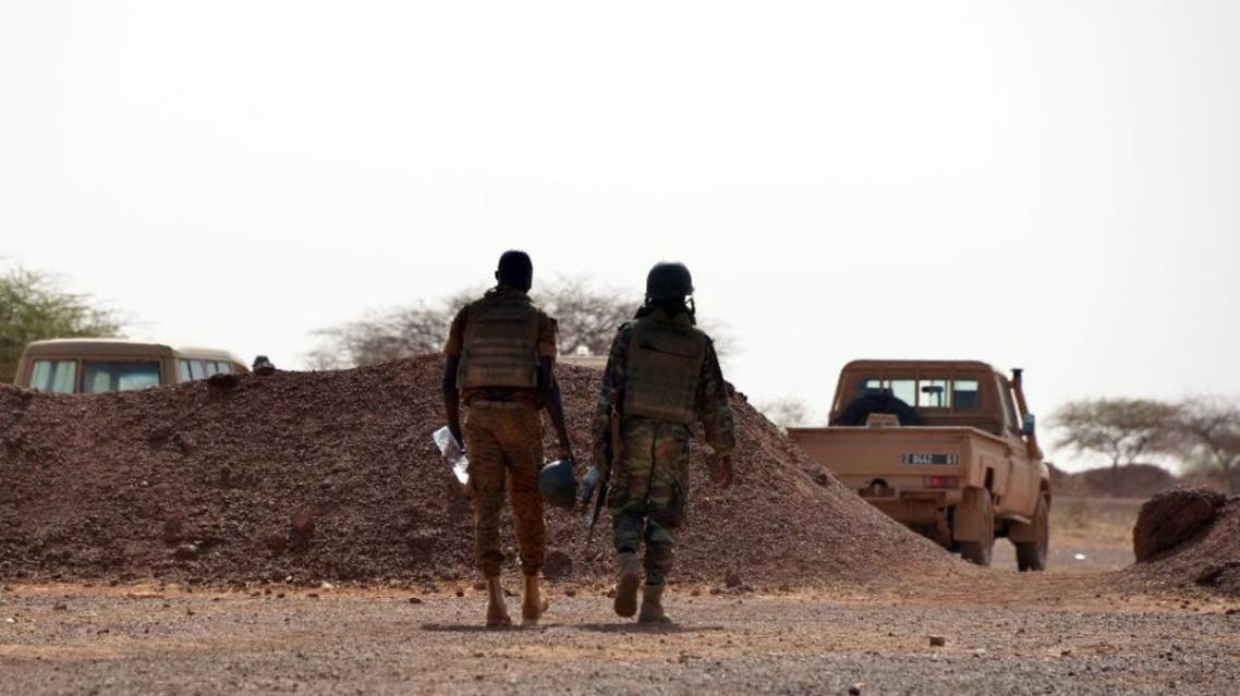 Burkina Faso soldiers patrol near Tambao mine in Tambao, 350 kilometers (220 miles) northeast of the capital, Ouagadougou on April 5, 2015, where five armed men attacked a manganese mine and kidnapped a Romanian mineworker the day before (AFP Photo/Ahmed Ouoba)