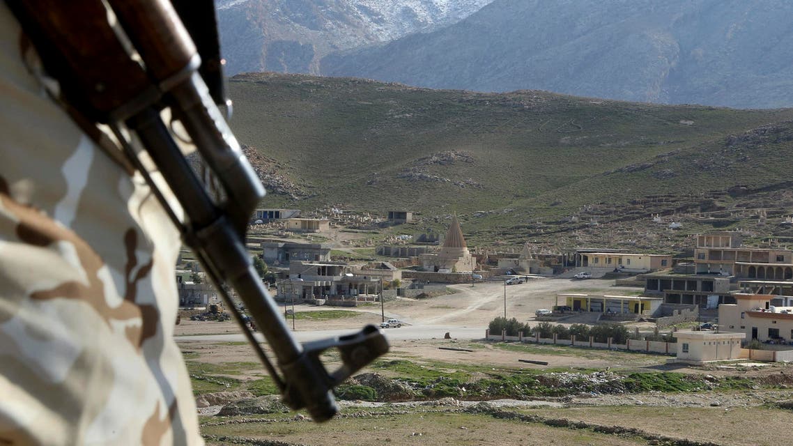In this Sunday Jan. 11, 2015 file photo, a Yazidi fighter protects the Sharaf al-Deen temple shrine, one of the holiest for the Yazidis, a religious minority whom the Islamic State group considers heretics ripe for slaughter, in Sinjar, northern Iraq. While Islamic State fighters have been forced to retreat from Kobani, the strategic town on Syria’s border with Turkey, they appear far from beaten in northern Iraq. Along the Kurds’ shifting front lines, it’s a tenuous hold. Whichever side triumphs will determine whether Islamic State can use the main highway west to funnel weapons and reinforcements to their retreating comrades in Syria. (AP Photo/Seivan Selim, File)