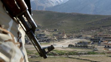  In this Sunday Jan. 11, 2015 file photo, a Yazidi fighter protects the Sharaf al-Deen temple shrine, one of the holiest for the Yazidis, a religious minority whom the Islamic State group considers heretics ripe for slaughter, in Sinjar, northern Iraq. While Islamic State fighters have been forced to retreat from Kobani, the strategic town on Syria’s border with Turkey, they appear far from beaten in northern Iraq. Along the Kurds’ shifting front lines, it’s a tenuous hold. Whichever side triumphs will determine whether Islamic State can use the main highway west to funnel weapons and reinforcements to their retreating comrades in Syria. (AP Photo/Seivan Selim, File)