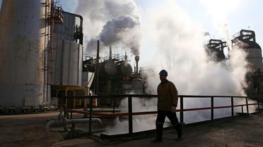 An Iranian oil worker walks in Tehran's oil refinery south of the capital Tehran, Iran, Monday, Dec. 22, 2014. (File: AP)