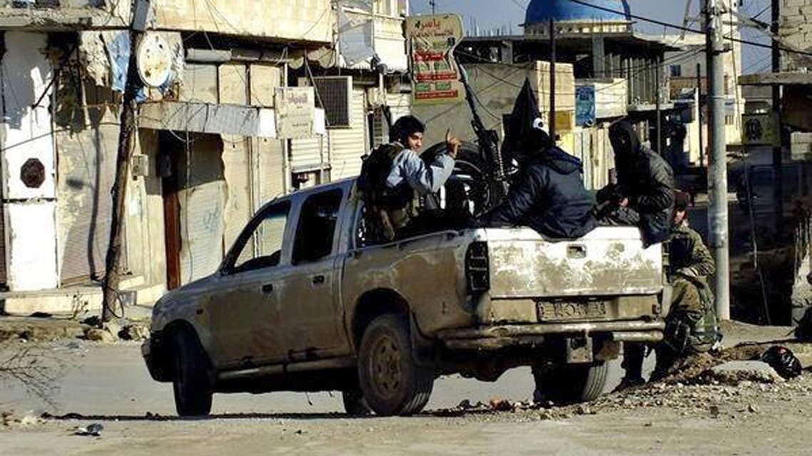 This undated file image posted on a militant website on Tuesday, Jan. 14, 2014 shows fighters from the al-Qaida linked Islamic State of Iraq and the Levant (ISIL) marching in Raqqa, Syria. (AP)