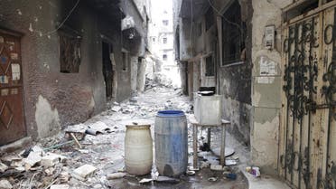 Rubble and heavy damage remain on a deserted street during a government escorted visit to Yarmouk refugee camp in Damascus, Syria, Thursday, April 9, 2015.  (AP)