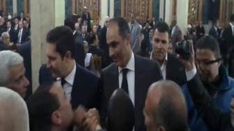 Freed Mubarak sons appear at funeral in downtown Cairo 