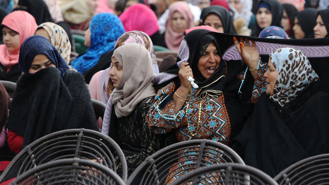 Palestinian women take part in a mass wedding ceremony in Gaza City, on April 11, 2015. (AFP)