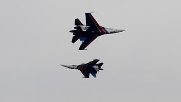 Su-27 fighter jets of the Russian pilot group Russian Knights perform at the the MAKS Air Show in Zhukovsky outside Moscow, Friday, Aug. 30, 2013. (AP Photo)