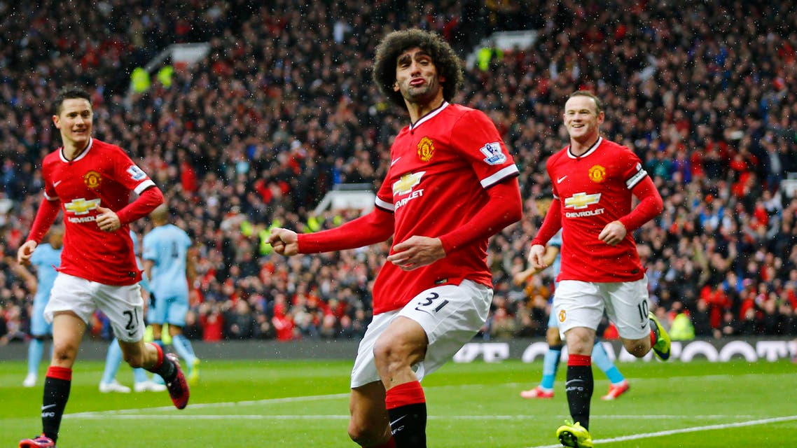 Football: Marouane Fellaini celebrates scoring the second goal for Manchester United. Reuters