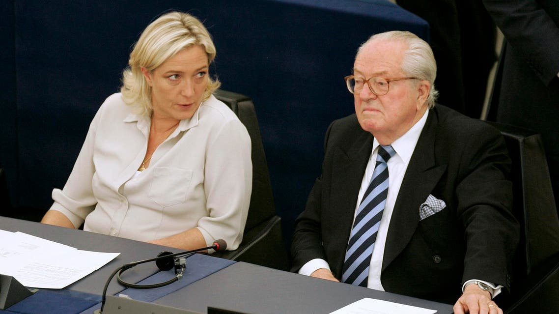 File photo of Jean-Marie Le Pen (R) and his daughter Marine Le Pen sit at the European Parliament, in Strasbourg, eastern France. (File Photo: AP)