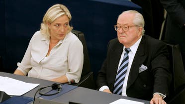 File photo of Jean-Marie Le Pen (R) and his daughter Marine Le Pen sit at the European Parliament, in Strasbourg, eastern France. (File Photo: AP) 