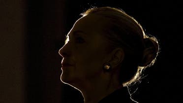 U.S. Secretary of State Hillary Clinton is silhouetted by a stage light as she speaks at the University of the Western Cape about the U.S.-South Africa partnership, in Cape Town in this August 8, 2012 file photo. Hillary Clinton announced her second run for the presidency on April 12, 2015, starting her campaign as the Democrats' best hope of fending off a crowded field of lesser-known Republican rivals and retaining the White House. REUTERS/Jacquelyn Martin/Pool/Files FROM THE FILES PACKAGE 'Hillary Clinton Announces Presidential Bid' SEARCH 'Hillary Clinton Announces Presidential Bid' FOR ALL 20 IMAGES