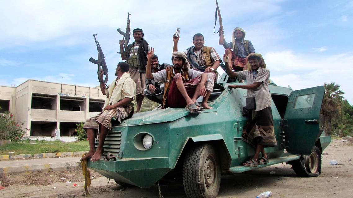 In this Friday, March 20, 2015 file photo, militiamen loyal to President Abdrabbu Mansour Hadi ride on an army vehicle on a street in Aden, Yemen. (AP)