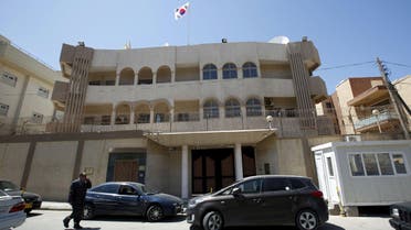 A man walks past the South Korean embassy after it was attacked by gunmen in Tripoli April 12, 2015. (Reuters)