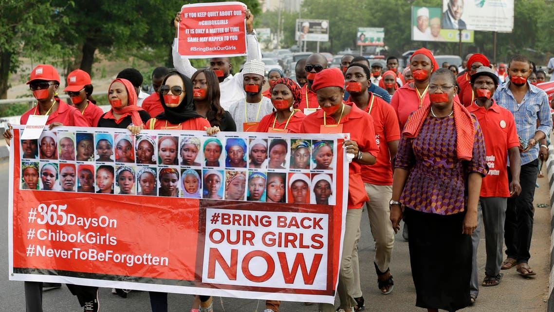 People march during a silent protest calling on the government to rescue the kidnapped girls of the government secondary school in Chibok, who were abducted a year ago, in Abuja, Nigeria, April 13, 2015. (AP)