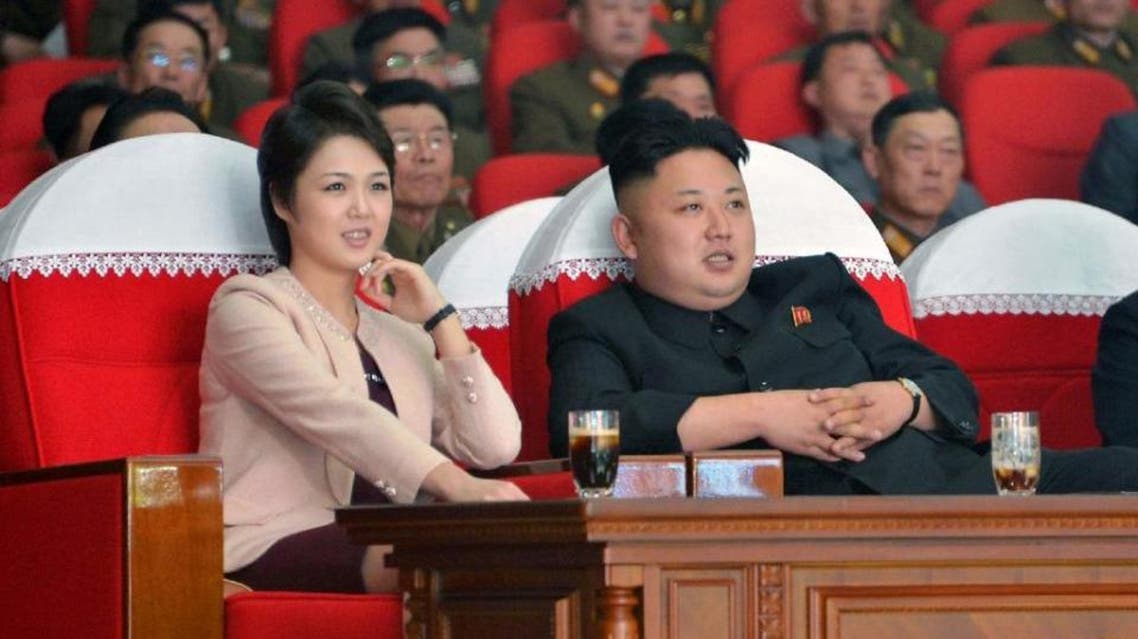 North Korean leader Kim Jong-Un and his wife Ri Sol-Ju watches a performance by the Moranbong Band at the April 25 House of Culture on March 22, 2014. (File Photo: AFP)