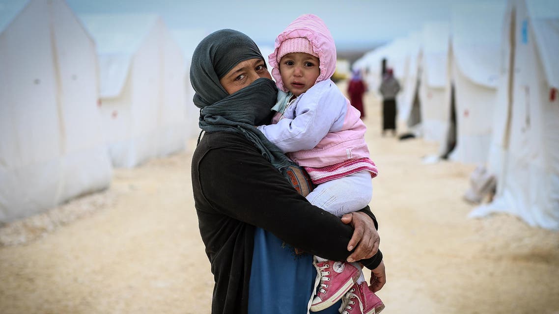 A Syrian refugee woman who fled violence in Syrian city of Kobane seen outside her tent in Turkey’s newly set-up camp in the border town of Suruc, Turkey, Friday, Jan. 30, 2015. (AP)