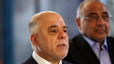 Iraqi Prime Minister Haider al-Abadi, left, holds a press conference before leaving to United States at Baghdad airport, Iraq, Monday, April 13, 2015. (AP)