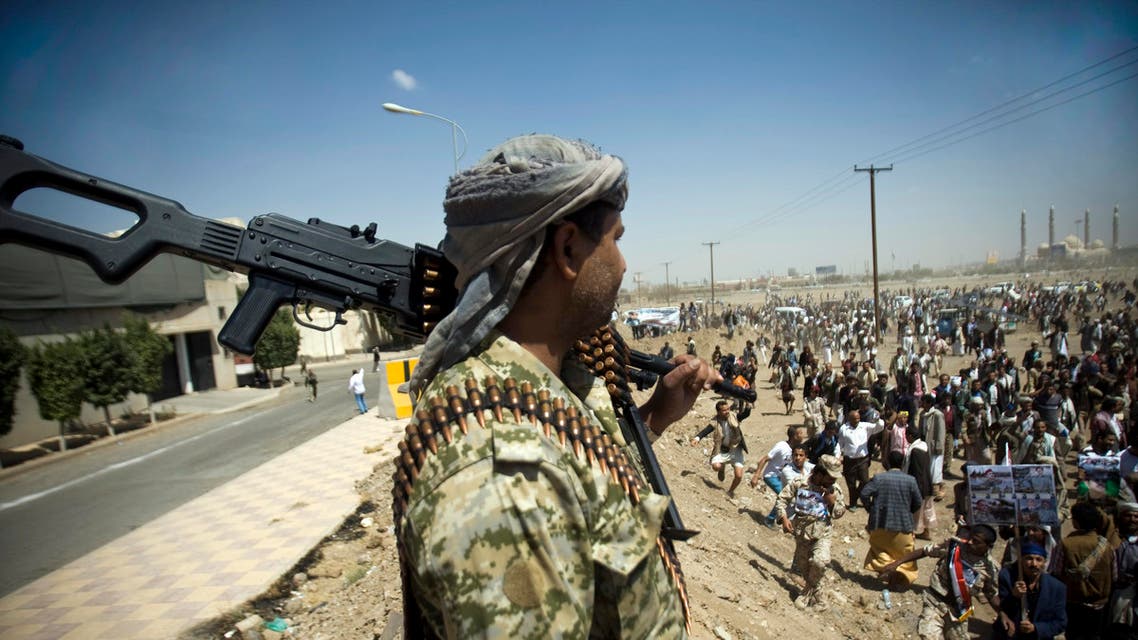 A Yemeni soldier stands guard as supporters of Ahmed Ali Abdullah Saleh, the son of Yemeni former President Ali Abdullah Saleh, gather during a demonstration. (AP)