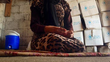 In this file photo taken on Oct. 8, 2014, a 15-year-old Yazidi girl captured by ISIS and forcibly married to a militant in Syria sits on the floor of a house she now shares with her family after escaping in early August. (AP) 