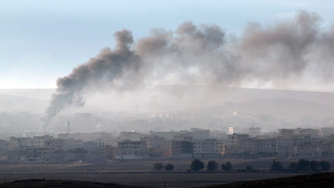 [Window Title] Enter name of file to save to…  [Content] Thick smoke from a fire rises following a strike in Kobani, Syria, during fighting between Syrian Kurds and the militants of Islamic State group, as seen from a hilltop on the outskirts of Suruc, at the Turkey-Syria border, Sunday, Oct. 19, 2014. (AP) The file name is not valid.  [OK]