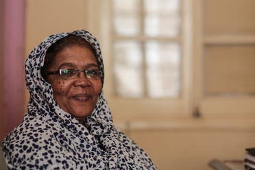 In this Sunday, April 12, 2015 photo, Madeha Abdullah, chief editor of al-Midan weekly, a mouthpiece of Sudan's Communist party, poses for a portrait during an interview in her office, in Khartoum, Sudan. When the weekly newspaper Al-Midan ran a statement by a rebel group supporting protesters demanding better services, authorities quickly confiscated the edition. Abdullah, was hauled before prosecutors and charged with “attempting to topple the constitutional system” _ a crime punishable by death. (AP Photo/Mosa'ab Elshamy)