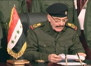 A still from early 2013 showing the fugitive Douri reading out a statement, calling on Iraqis to rise up against the government of then-Prime Minister Nouri al-Maliki (Image grab)