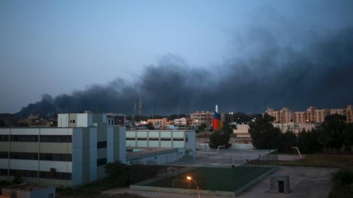 Black smoke billows in the sky above areas where clashes are taking place between pro-government forces, who are backed by the locals, and the Shura Council of Libyan Revolutionaries, an alliance of former anti-Gaddafi rebels, who have joined forces with the Islamist group Ansar al-Sharia, in Benghazi April 18. (Reuters)