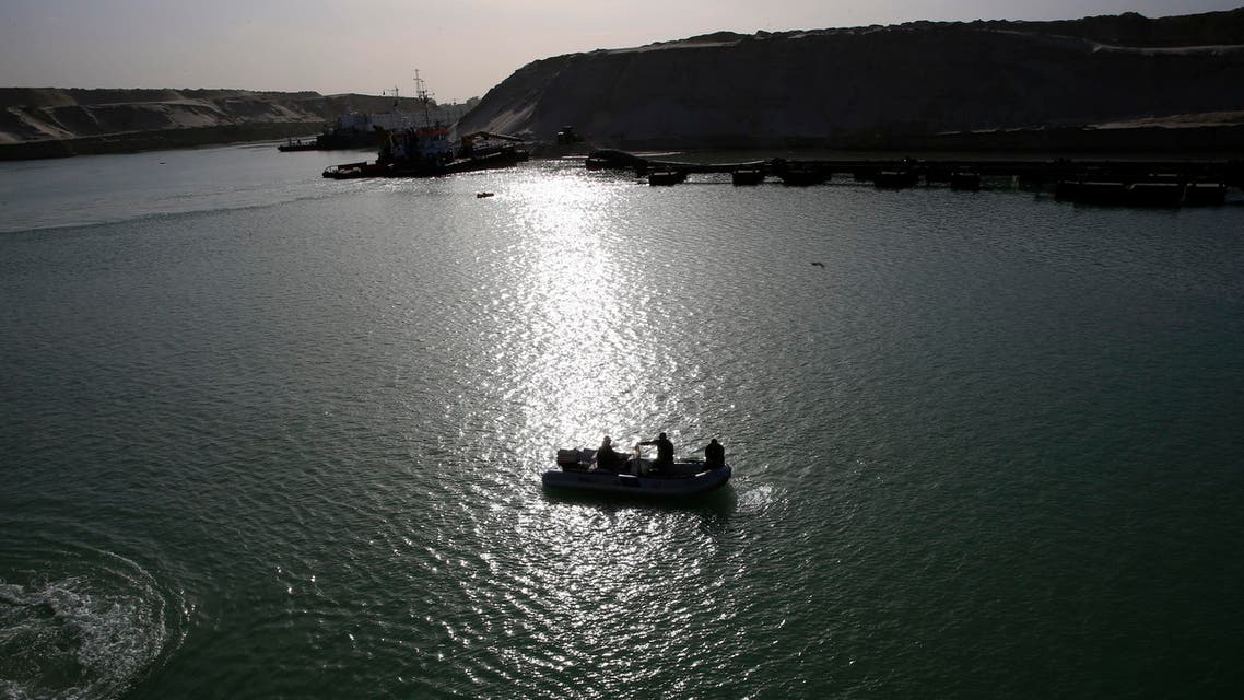 In this Wednesday, Feb. 4, 2015 photo, Egyptian security patrol the new section of the Suez canal during a media tour in Ismailia, Egypt. (AP)