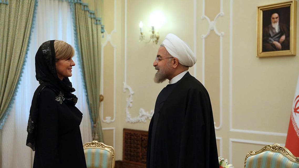 Iran's President Hassan Rouhani, right, greets Australian Foreign Minister Julie Bishop at the start of their meeting in Tehran, Iran, Saturday, April 18, 2015. (AP)