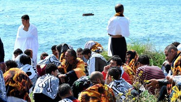 Migrants are seen on the shore in the eastern Aegean island of Rhodes, Geece on Monday, April 20, 2015. (AP)