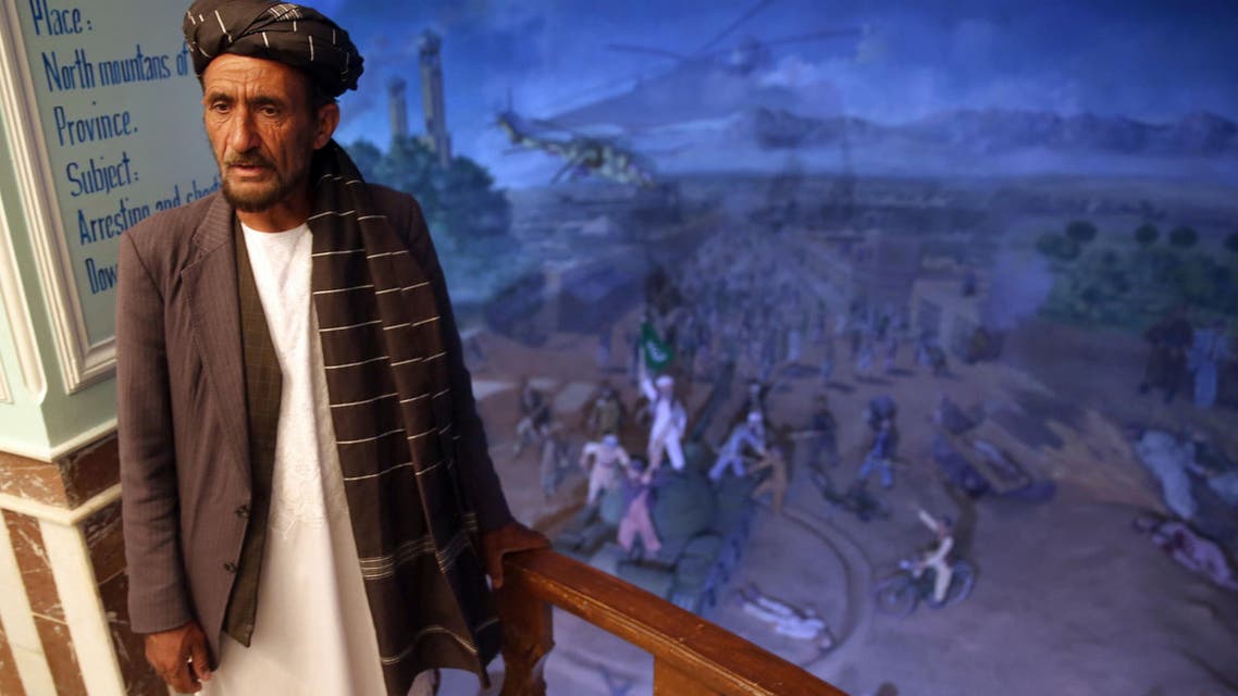 In thiIn this Sunday, April 12, 2015 photo, tour guide Sayed Hassan, speaks during an interview with The Associated Press, at the Jihad Museum, in Herat city.