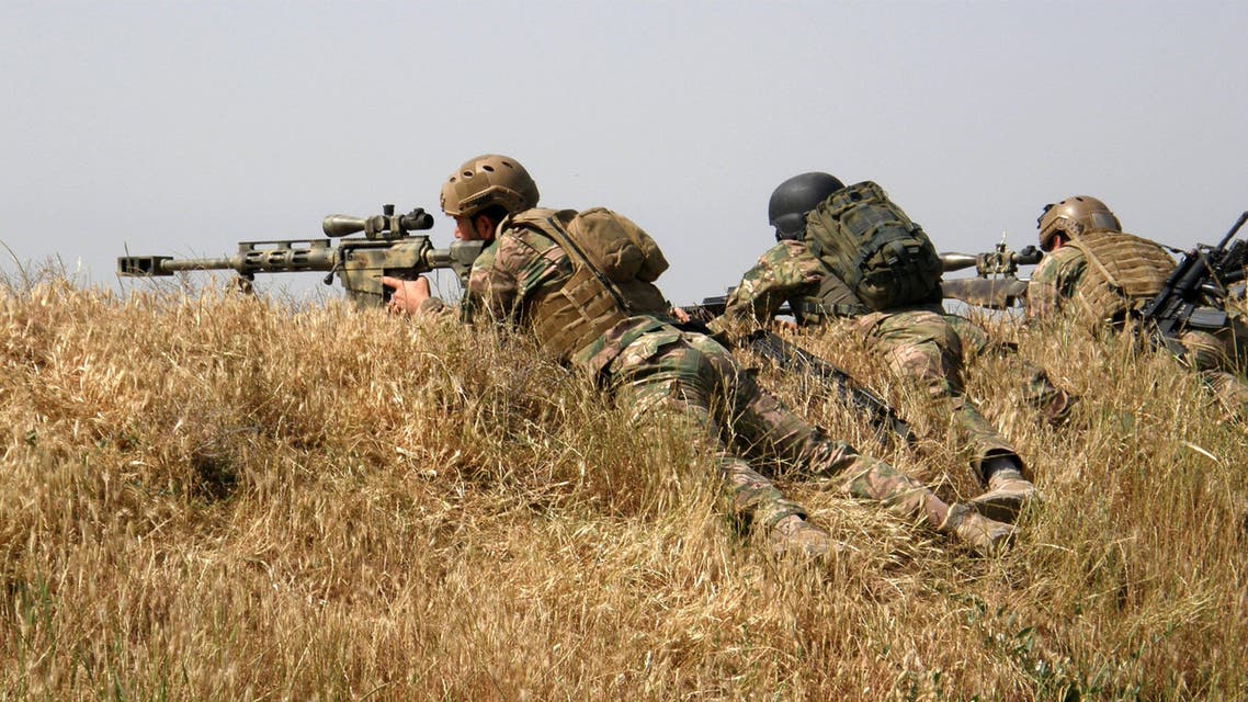 Kurdish security forces attack Islamic State extremists outside the oil-rich city of Kirkuk, 180 miles (290 kilometers) north of Baghdad, Iraq, Saturday, April 18, 2015. On Saturday, Kurdish peshmerga forces recaptured two villages just south of the oil-rich city of Kirkuk that lie near the highway linking it to Baghdad, said Rasould Omar, a senior official in the Patriotic Union of Kurdistan. (AP Photo)