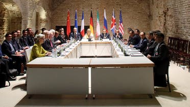 Negotiators of Iran and six world powers face each other at a table in the historic basement of Palais Coburg hotel in Vienna April 24, 2015. Nuclear talks are making good but slow progress as they work towards a June 30 deadline for a final deal, Tehran's senior negotiator Abbas Araqchi said on Friday. REUTERS/Heinz-Peter Bader