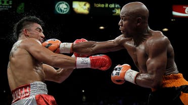 Floyd Mayweather Jr. hits Victor Ortiz Floyd during their WBC welterweight title fight Saturday, Sept. 17, 2011, in Las Vegas. (AP)