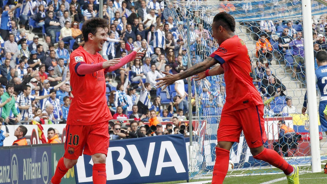 Barcelona's Lionel Messi celebrates his goal against Espanyol with teammate Neymar during their Spanish first division soccer match at Power8 stadium in Cornella de Llobregat near Barcelona. Reuters