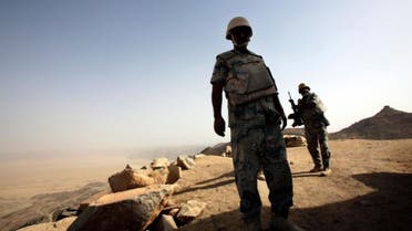 Saudi soldiers stand alert at the border with Yemen in Najran, Saudi Arabia, Tuesday, April 21, 2015. (AP)