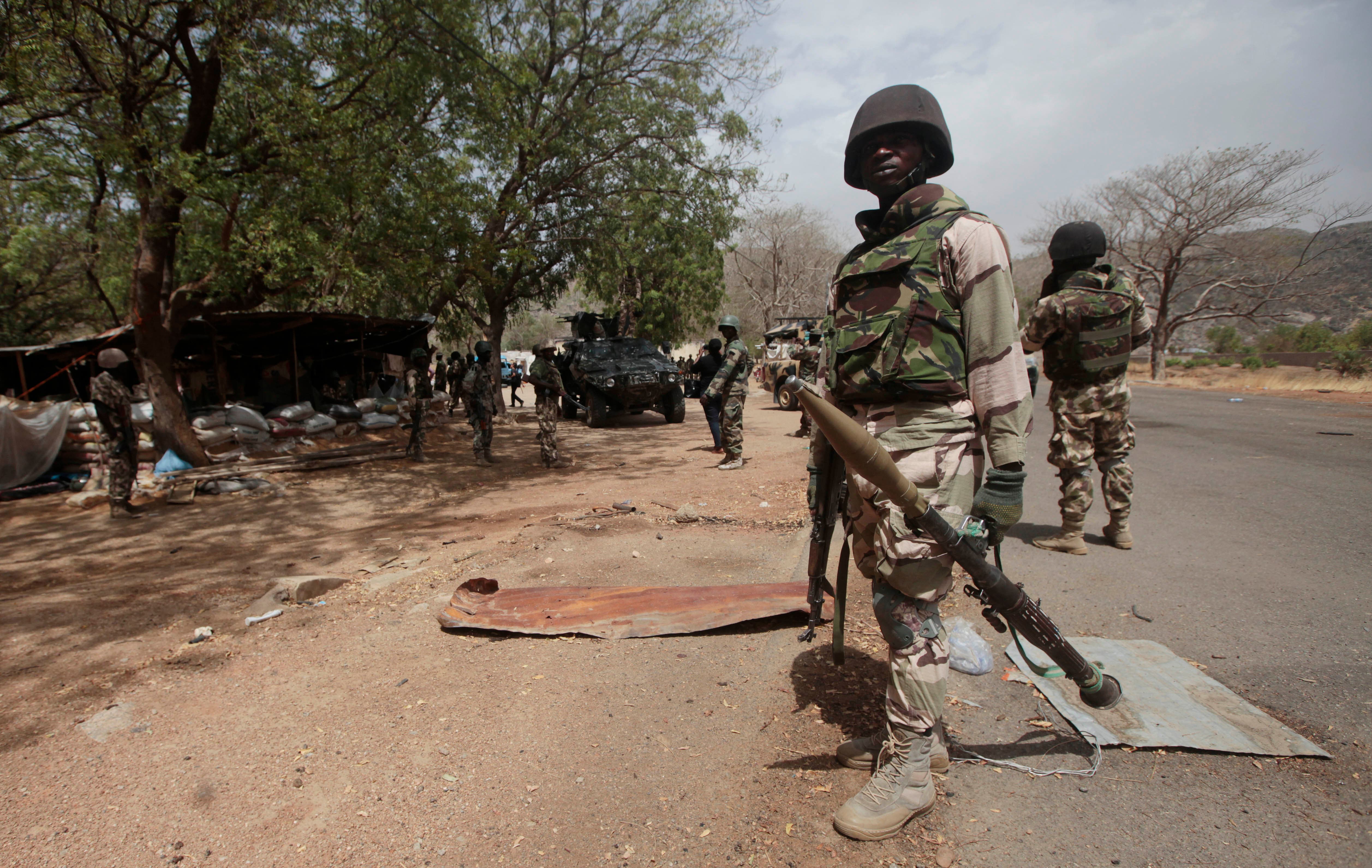 Nigerian Soldiers man a check point in Gwoza, Nigeria, a town newly liberated from Boko Haram. AP
