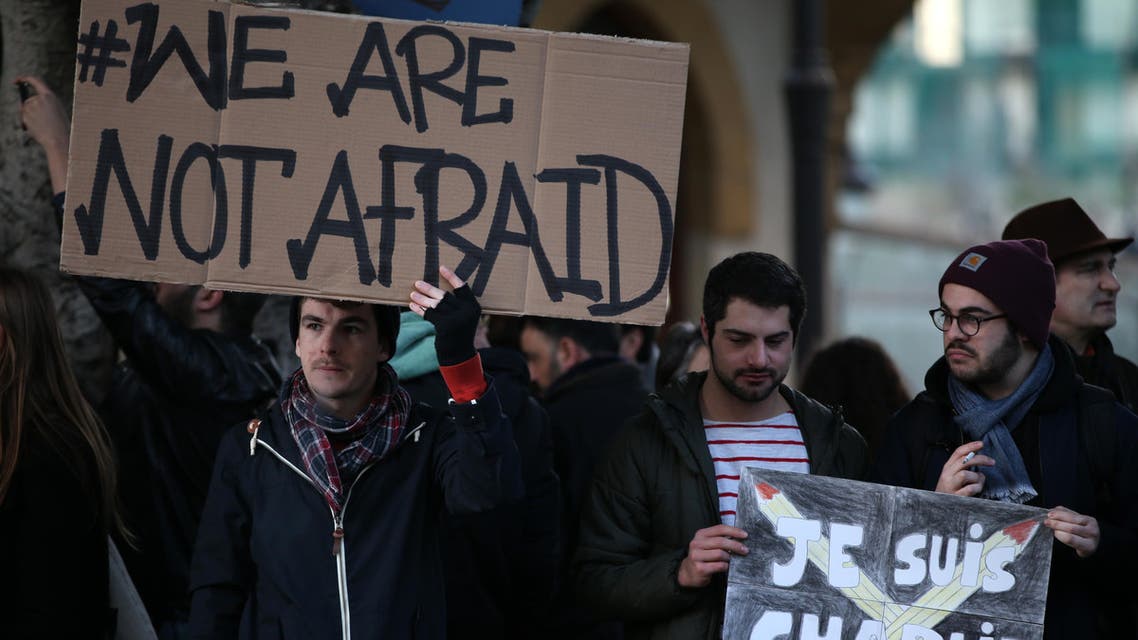 Lebanese and foreign journalists, activists and intellectuals, hold placards as they gather to show their solidarity with the victims of the Charlie Hebdo attack, in Lebanon, Sunday, Jan. 11, 2015. (File Photo: AP)