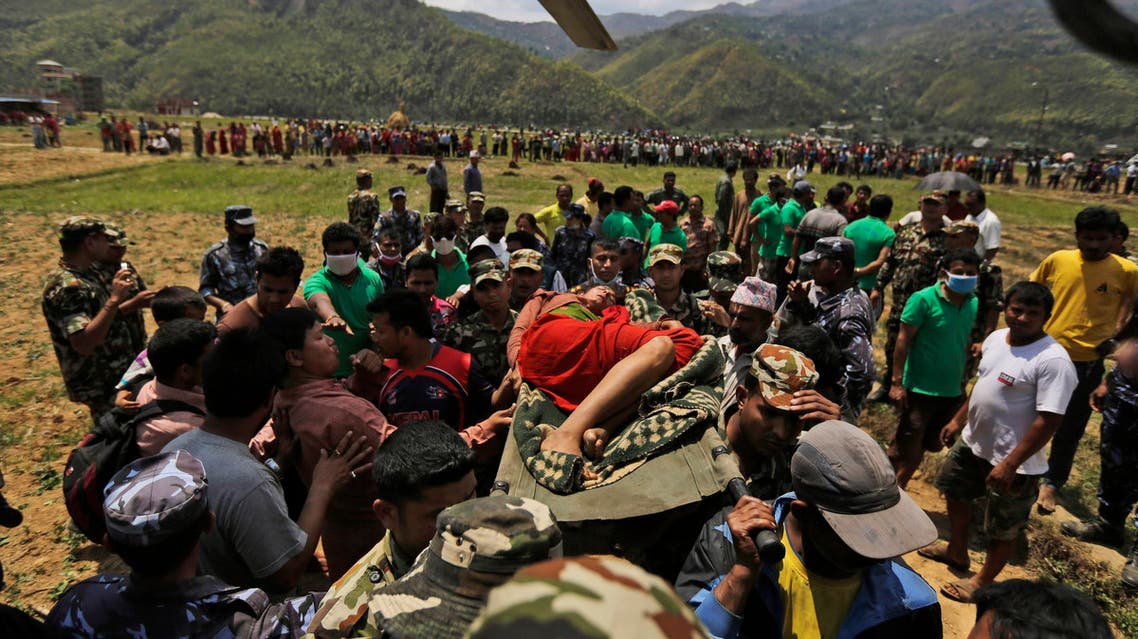 Nepalese soldiers carry a wounded woman to a waiting Indian air force helicopter as they evacuate victims of Saturday’s earthquake from Trishuli Bazar to Kathmandu airport in Nepal, Monday, April 27, 2015. AP
