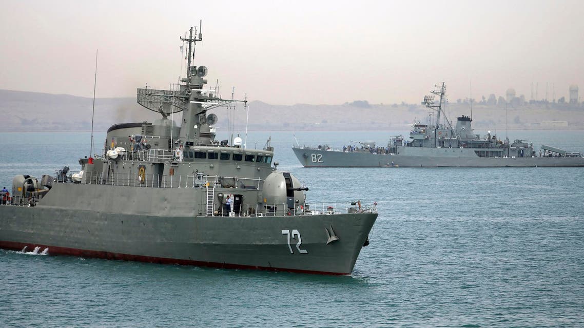 In this picture taken on Tuesday, April 7, 2015, and released by the semi-official Fars News Agency, Iranian warship Alborz, foreground, prepares before leaving Iran's waters. re