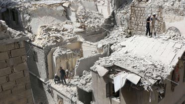  Destroyed buildings are seen after they were targeted in a reported barrel bomb attack by Syrian government forces on the central al-Fardous rebel held neighbourhood of the northern Syrian city of Aleppo, on April 29, 2015. AFP