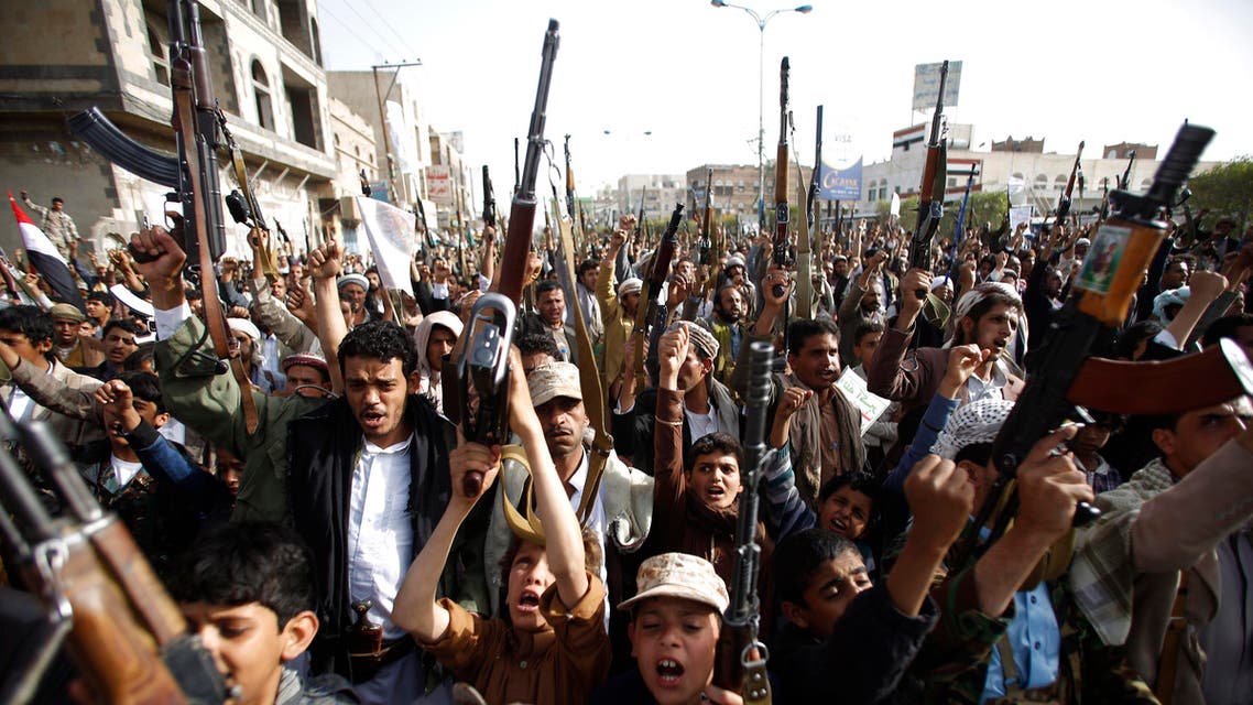Houthis hold up their weapons to denounce the Saudi-led airstrikes as they chant slogans during a protest in Sanaa, Yemen, Monday, April 27, 2015. (Reuters)