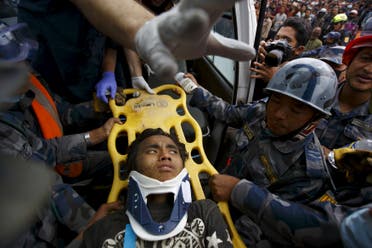 Earthquake survivor Pema Lama, 15, is rescued by the Armed Police Force from the collapsed Hilton Hotel, a result of an earthquake in Kathmandu, Nepal April 30, 2015. (Reuters)