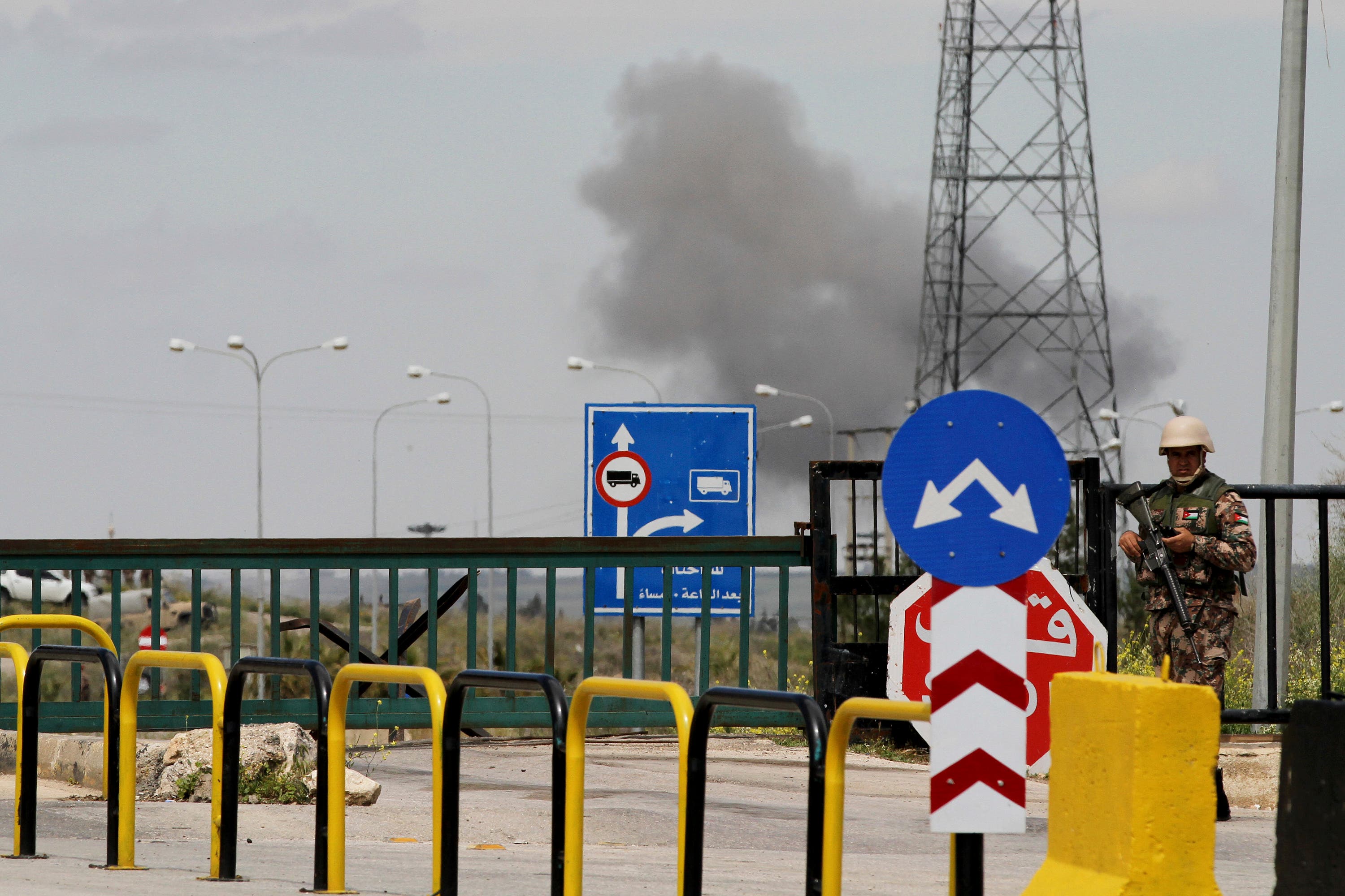 Jordananian border security protect the boarder to Syria as fighting continues in the background (AP)