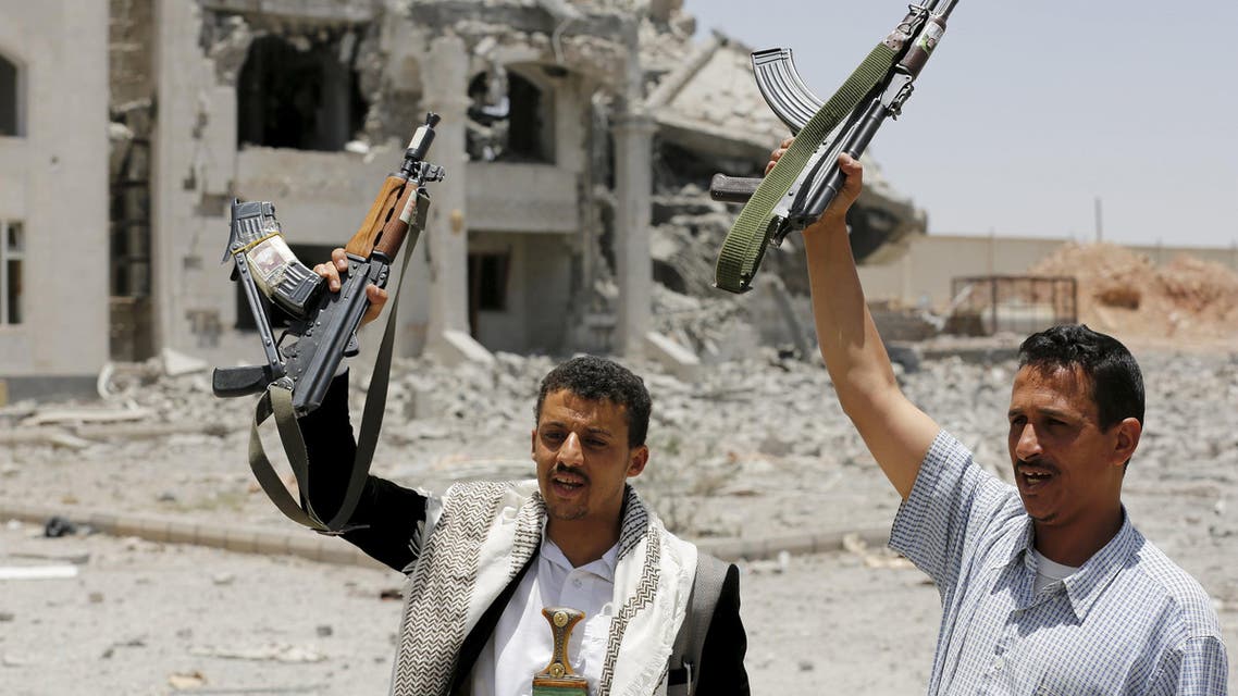 Houthi militants gesture in the yard of the residence of the military commander of the Houthi militant group, Abdullah Yahya al Hakim, after it was hit by an airstrike, in Sanaa April 28, 2015. (File Photo: Reuters)