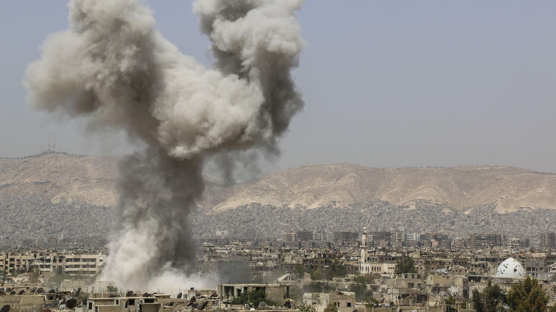 Smoke billows following air strikes by regime forces in the rebel-held area of Ain Tarma, east of the capital Damascus, on April 29, 2015. AFP PHOTO / MOHAMMED EYAD