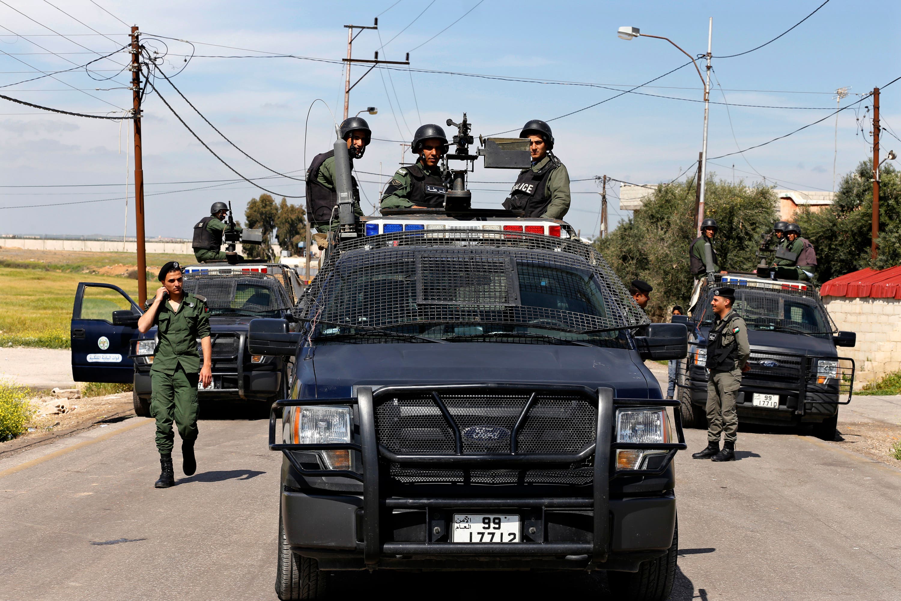 Members of the Jordanian government forces patrol the border with Syria near the Nasib crossing in the town of Jaber, north of Mafraq, Jordan, Thursday, April 2, 2015. Syrian rebels and fighters from the al-Qaida-affiliated Nusra Front captured the only functioning border crossing with Jordan and three nearby military posts, prompting Syrian government bombing raids on the area, activists said Thursday. The Jordanian government had closed the Nasib crossing Tuesday night for security reasons. (AP Photo/Raad Adayleh)