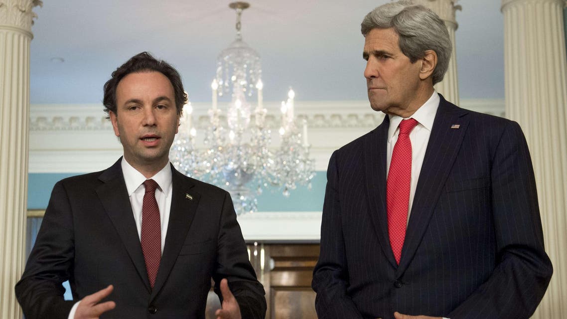 U.S. Secretary of State John Kerry and Syrian Opposition Council President Khaled Khoja(L) speak to the media prior to meetings at the State Department in Washington, DC, April 30, 2015. (AFP)