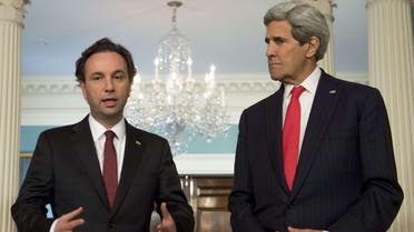  U.S. Secretary of State John Kerry and Syrian Opposition Council President Khaled Khoja(L) speak to the media prior to meetings at the State Department in Washington, DC, April 30, 2015. (AFP)
