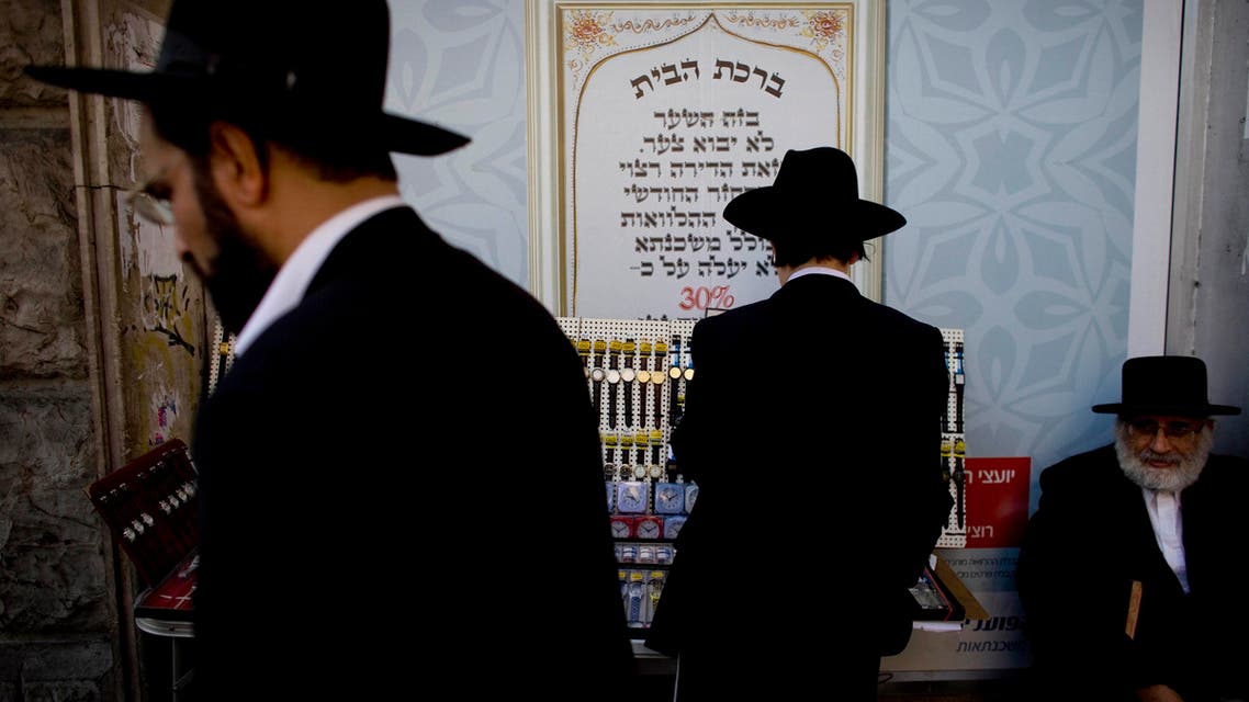 Ultra-orthodox Jewish men shop before Shabbat in the Mea Sharim neighborhood, Jerusalem, Friday, Nov. 12, 2010. (AP)