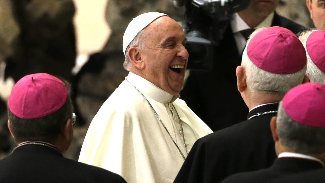 Pope Francis laughs during an audience with members of the Cursillos in Christianity movement, in the Paul VI hall, at the Vatican, Thursday, April 30, 2015. (AP)